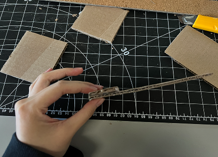 Building the base first, I added extra support by glueing an additional piece of cardboard.